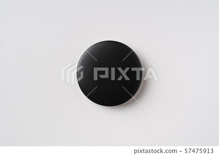 top view of black badge on grey background top view of black badge on grey background 57475913