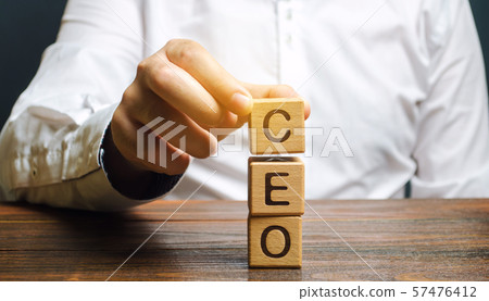 Wooden blocks with the word CEO and businessman. Wooden blocks with the word CEO and businessman. 57476412