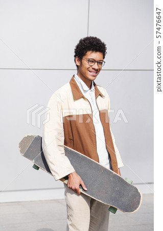 Close up portrait of african american skateboarder 57476647
