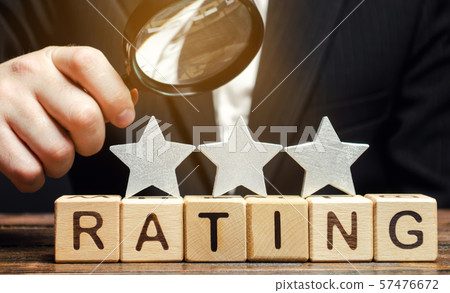 Wooden blocks with the word Rating, three stars 57476672