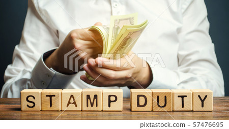 Wooden blocks with the word Stamp duty  57476695