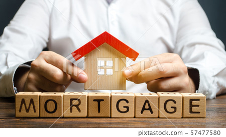Wooden blocks with the word Mortgage and house  57477580
