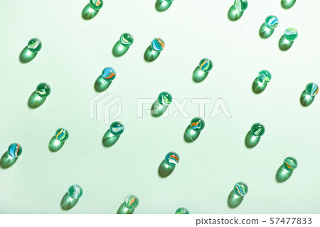 Little glass balls on mint background. 57477833