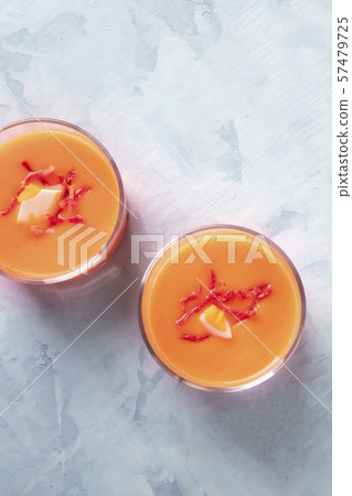 Salmorejo, Spanish cold tomato and bread soup, served in glasses, overhead shot with copyspace 57479725