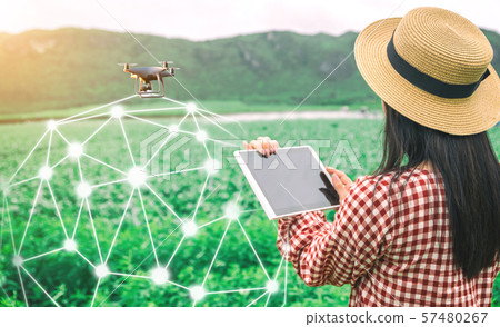Tablet in the hands of farmers technology drones to control agricultural products Tablet in the hands of farmers technology drones to control agricultural products 57480267