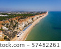 Endless beautiful tourist ocean beach in Portugal, near Albufeira drone aerial view 57482261