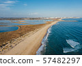 Aerial view of beautiful Meia Praia beach near tourist town Lagos, Algarve, Portugal at evening 57482297