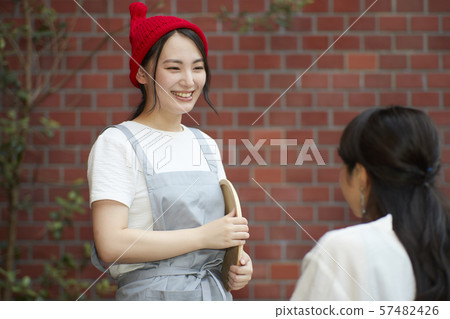 A young woman working in a cafe A young woman working in a cafe 57482426
