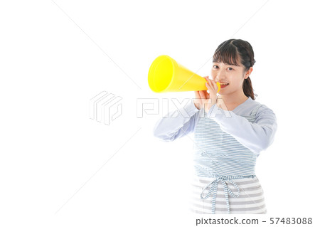 Young housewife cheering mechaphone Young housewife cheering mechaphone 57483088