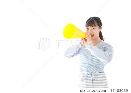 Young housewife cheering mechaphone Young housewife cheering mechaphone 57483089