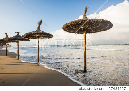 Flooded umbrellas on the beach of Mallorca 57483337