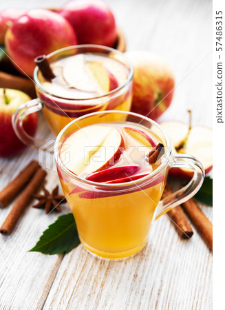 Apple cider  with cinnamon sticks 57486315