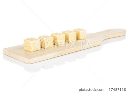Brown sugar cube isolated on white Brown sugar cube isolated on white 57487138