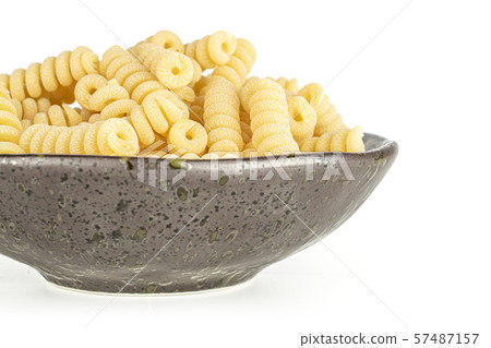 Raw pasta fusilli bucati isolated on white Raw pasta fusilli bucati isolated on white 57487157