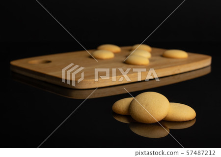 Sweet sponge biscuit isolated on black glass 57487212