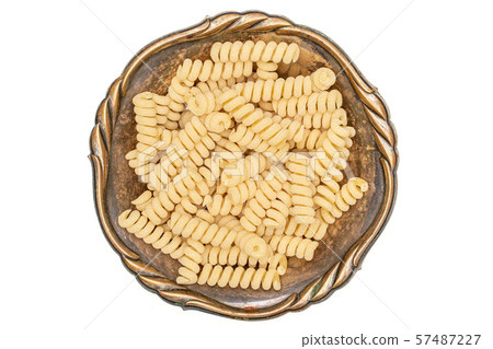 Raw pasta fusilli bucati isolated on white Raw pasta fusilli bucati isolated on white 57487227