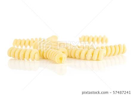 Raw pasta fusilli bucati isolated on white Raw pasta fusilli bucati isolated on white 57487241