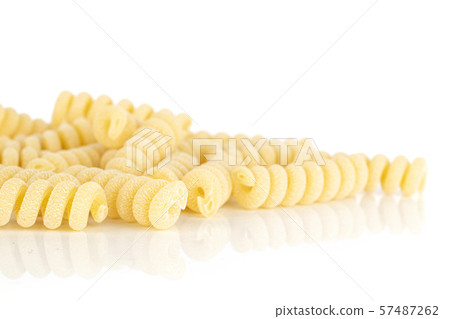 Raw pasta fusilli bucati isolated on white Raw pasta fusilli bucati isolated on white 57487262