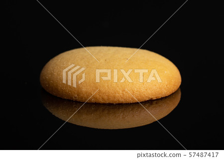 Sweet sponge biscuit isolated on black glass Sweet sponge biscuit isolated on black glass 57487417