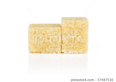 Brown sugar cube isolated on white Brown sugar cube isolated on white 57487516