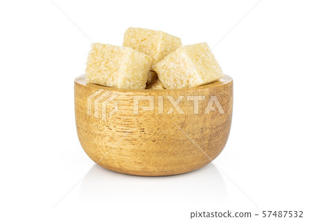 Brown sugar cube isolated on white 57487532