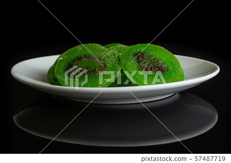 Sweet candied kiwifruit isolated on black glass 57487719