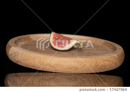 Fresh fig fruit isolated on black glass Fresh fig fruit isolated on black glass 57487969