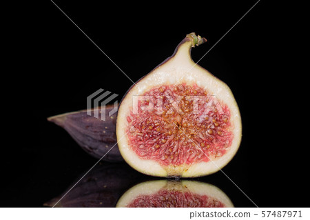 Fresh fig fruit isolated on black glass Fresh fig fruit isolated on black glass 57487971