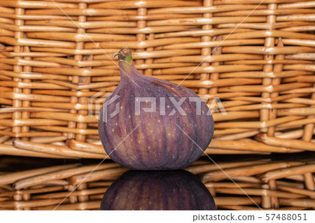 Fresh fig fruit with braided rattan Fresh fig fruit with braided rattan 57488051
