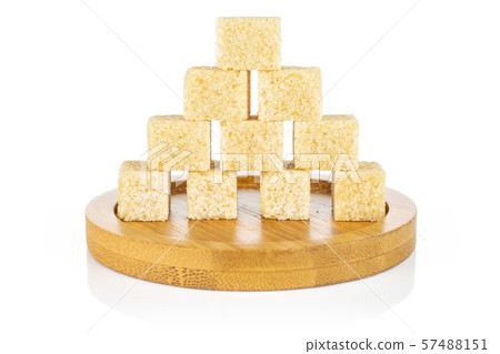 Brown sugar cube isolated on white Brown sugar cube isolated on white 57488151