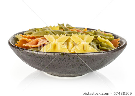 Raw farfalle tricolore isolated on white Raw farfalle tricolore isolated on white 57488169
