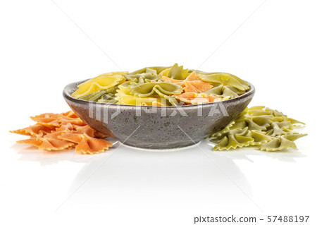 Raw farfalle tricolore isolated on white Raw farfalle tricolore isolated on white 57488197