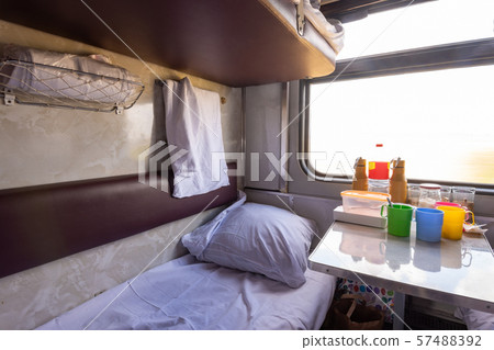 Empty bottom bunk in a reserved seat carriage and 57488392