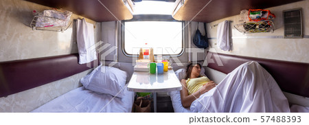 Panorama of the interior of a reserved seat train 57488393