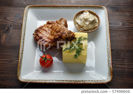 Steak on the bone with red sauce. restaurant menu 57490608