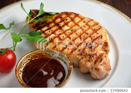 Steak on the bone with red sauce. restaurant menu 57490642