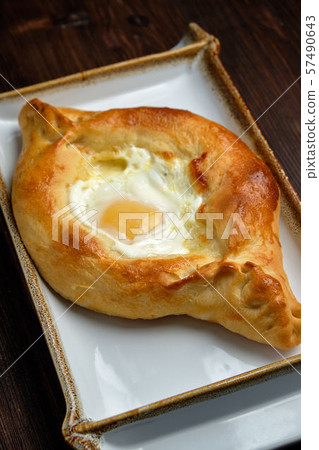 Khachapuri with egg in Adjarian. restaurant menu Khachapuri with egg in Adjarian. restaurant menu 57490643