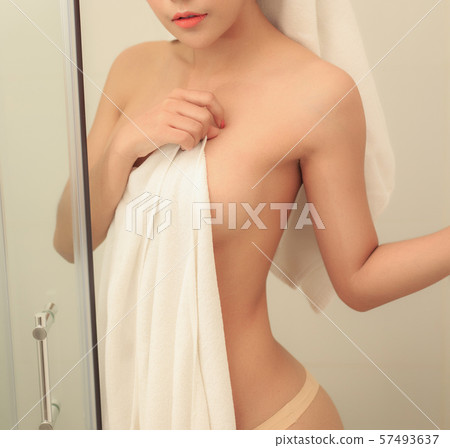 Beautiful slim body of woman wrapped with towel. 57493637