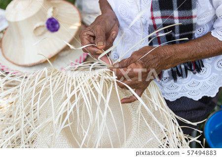 The villagers took bamboo stripes to weave into 57494883