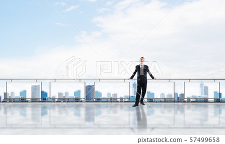 Sunrise above skyscrapers and businessman facing new day Sunrise above skyscrapers and businessman facing new day 57499658