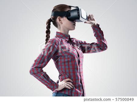 Girl in mask experiencing virtual reality as new entertainment device 57500849