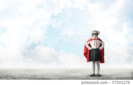 Girl power concept with cute kid guardian against cloudscape background . Mixed media Girl power concept with cute kid guardian against cloudscape background . Mixed media 57501278