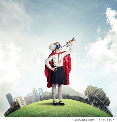 Girl power concept with cute kid guardian against cityscape background Girl power concept with cute kid guardian against cityscape background 57503197