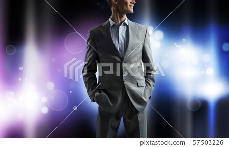 Confident businessman in bokeh lights Confident businessman in bokeh lights 57503226