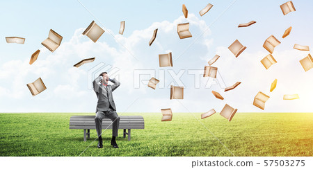 Young man in suit in park dont want to hear anything 57503275
