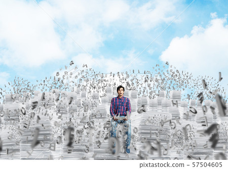 Attractive man sitting on pile of paper documents. Attractive man sitting on pile of paper documents. 57504605