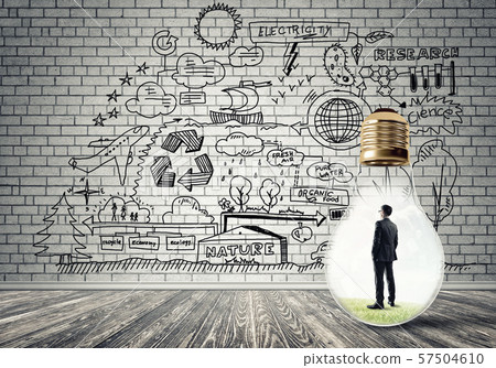 Businessman trapped in bulb Businessman trapped in bulb 57504610