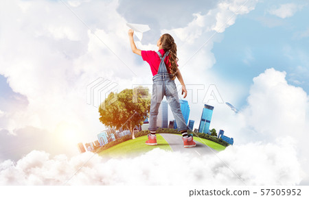 Concept of careless happy childhood with girl dreaming about future 57505952