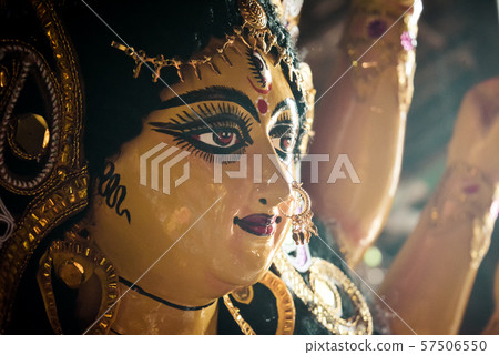 Close up side view face of Goddess Maa Durga Idol. 57506550