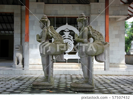 Sculptures of mythological deities in a Buddhist monastery, Java island, Indonesia 57507432